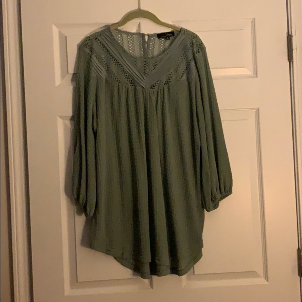 Sage green flowing top with lace cutouts